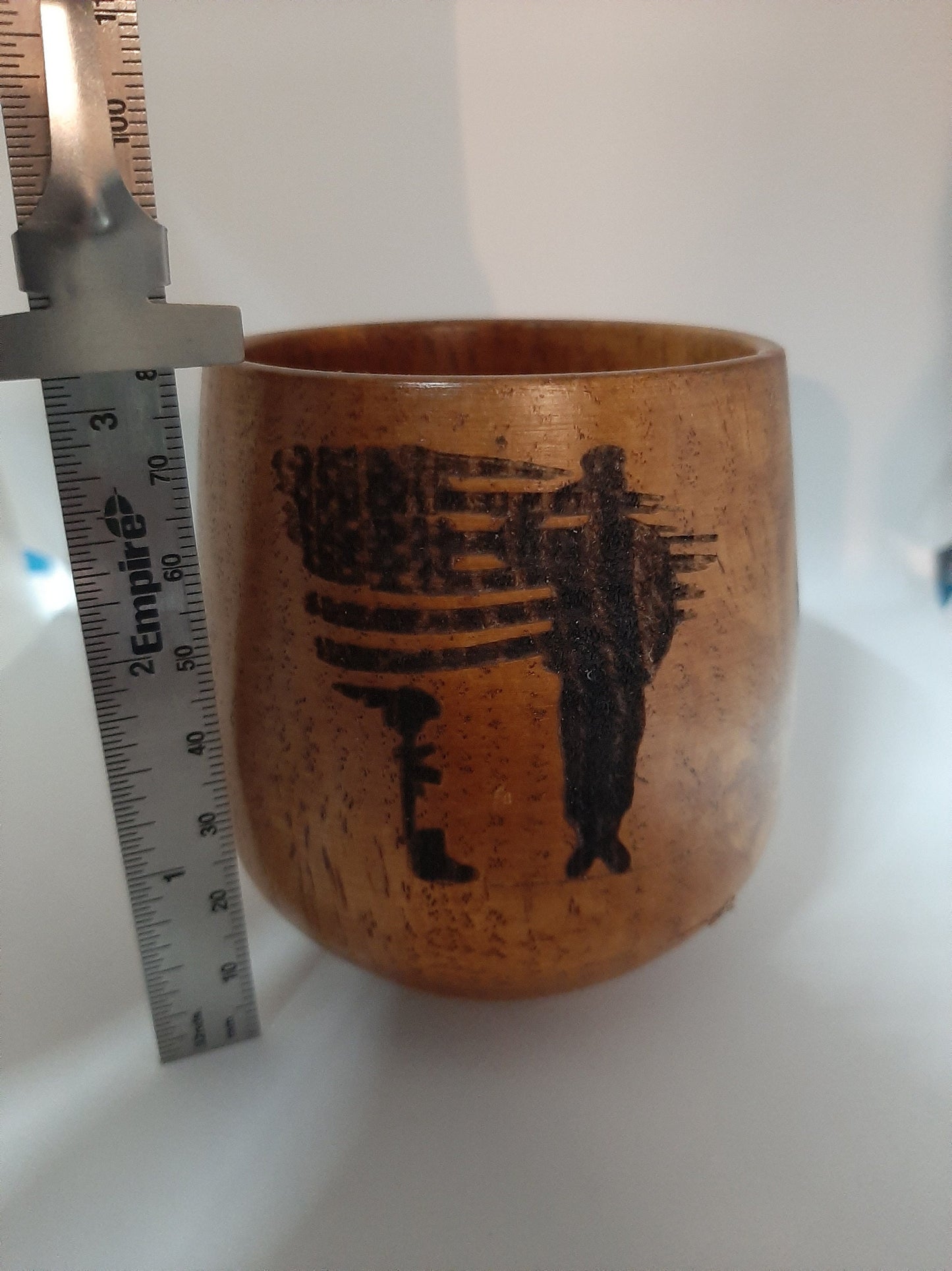 Laser engraved wooden whiskey cups.