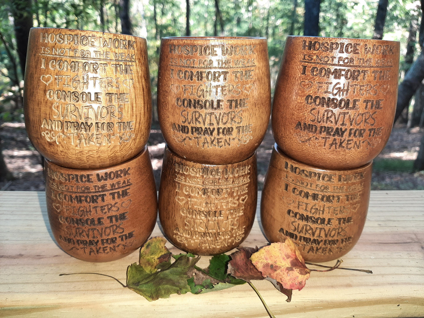 Laser engraved wooden whiskey cups.