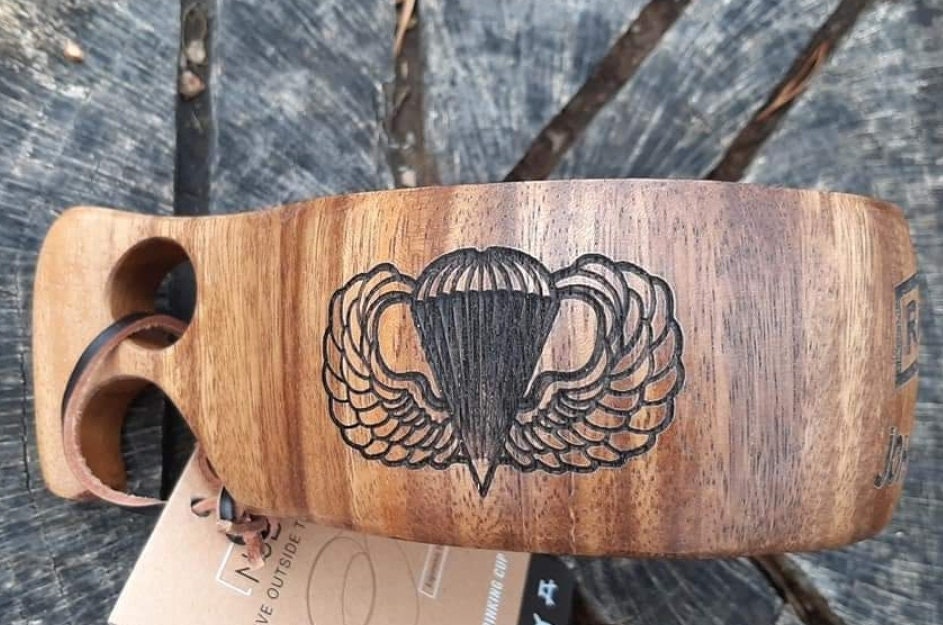 Laser engraved wooden whiskey cups.